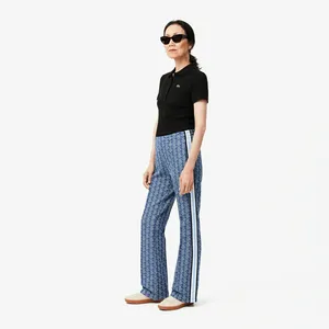 Спортивные брюки Lacoste расклешенные с монограммой, синий, арт. XF9313